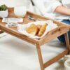 a men & women is trying Bamboo Breakfast Bed Tray Table at reconnect